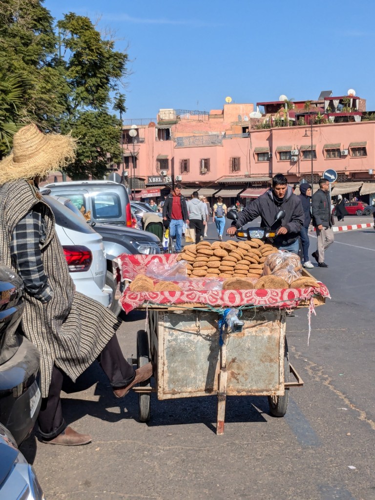 Traditional round loaves of bread sold form a cart - page 26
